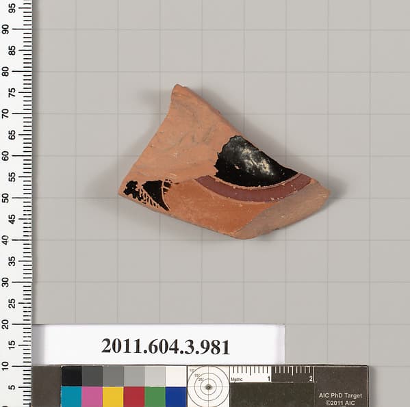 Terracotta fragment of a lekanis lid (covered dish)