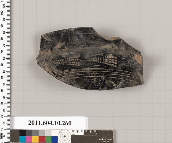 Terracotta rim fragment of a kylix (drinking cup)