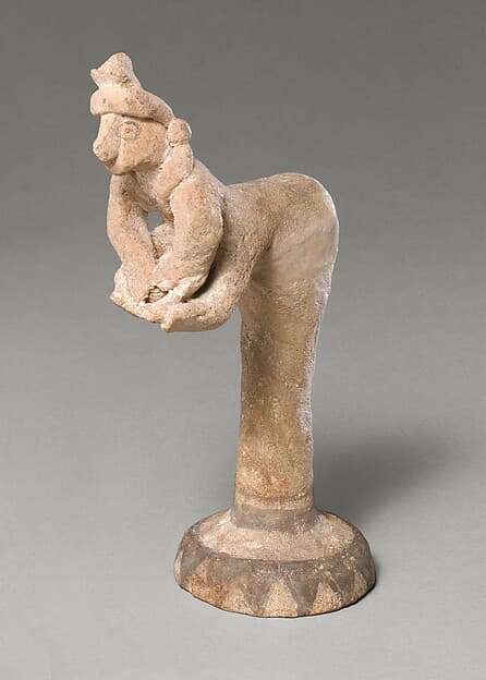 Female figurine kneading dough(?)