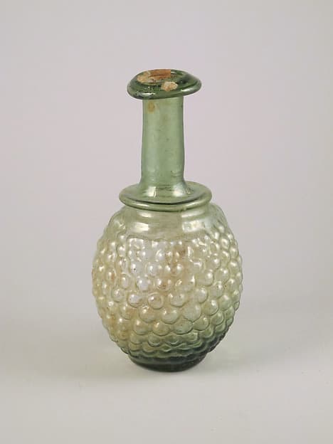 Glass bottle in the shape of a bunch of grapes