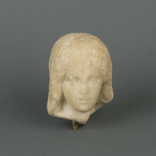 Marble head of a female statuette