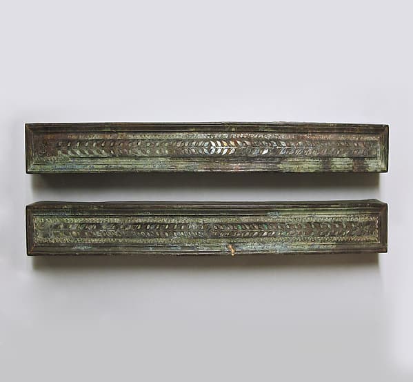 Bronze furniture attachments with silver inlay