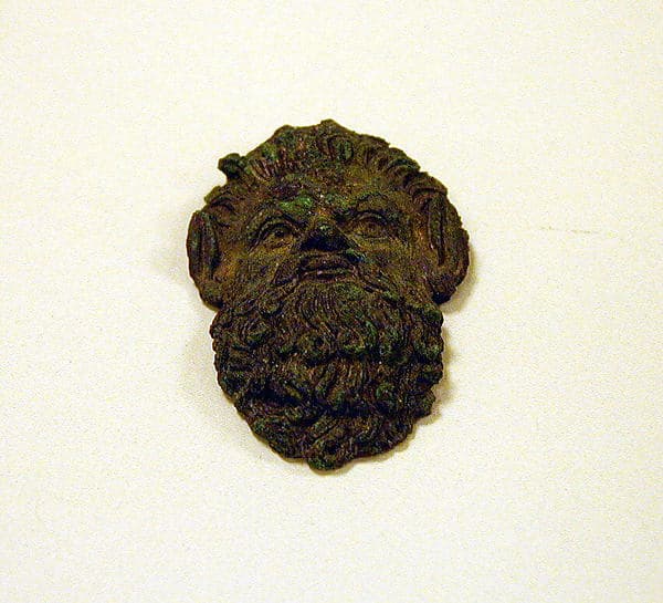 Bronze handle attachment in the form of a satyr mask