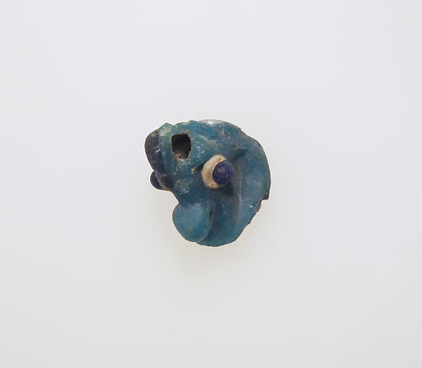 Glass pendant in the form of a demonic mask
