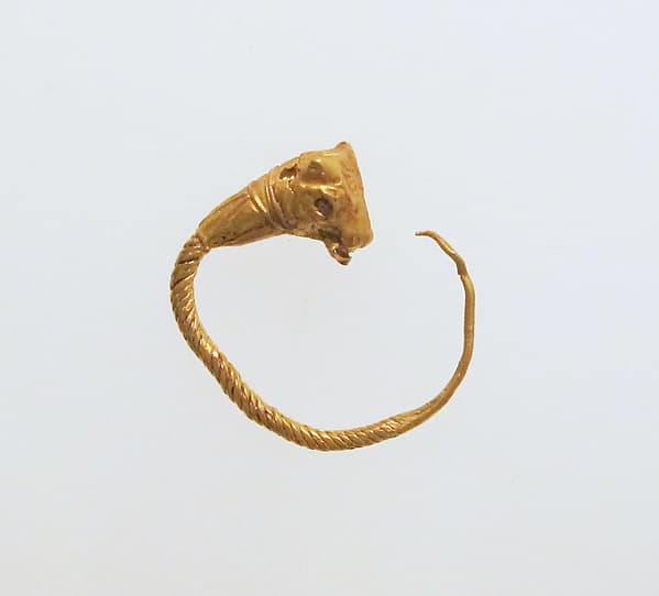 Gold earring with head of a bull
