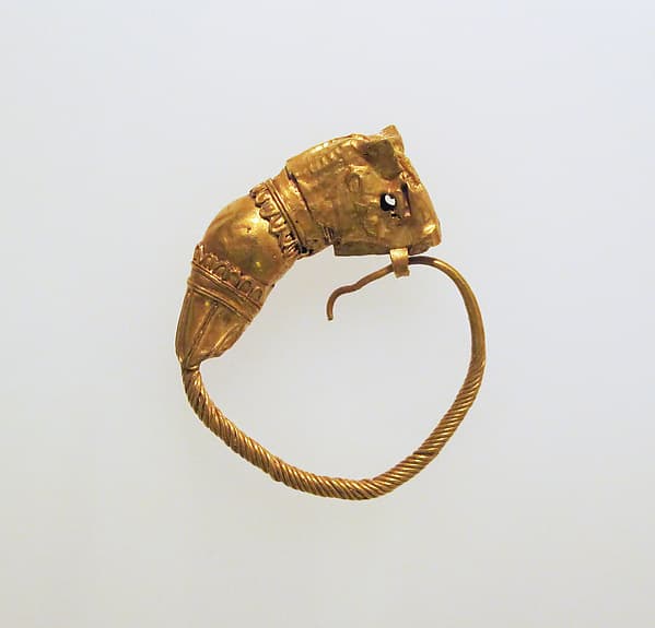 Gold earring with head of a bull