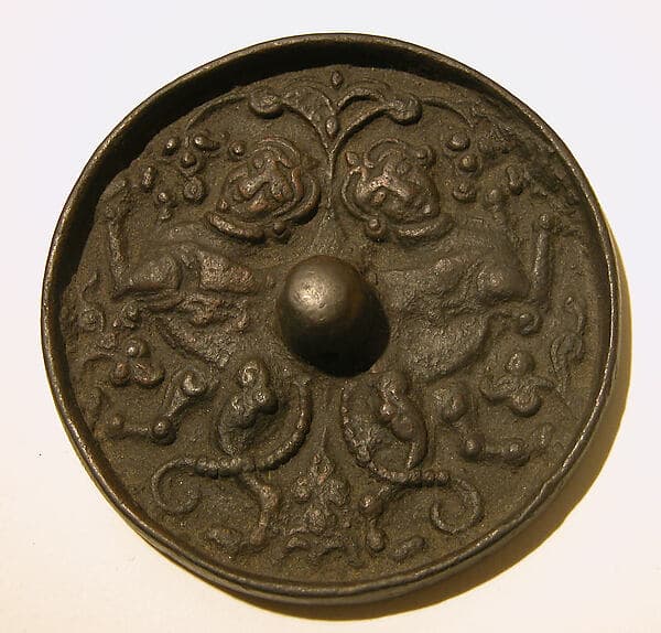 Mirror with a Pair of Addorsed Sphinxes with Scorpion Tails