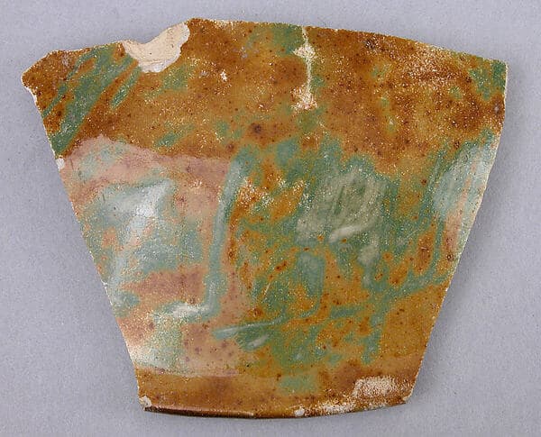 Fragment of a Lotus-Shaped Bowl with Luster and Green-Mottled Decoration