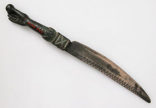 Knife with a Hand Holding an Orb