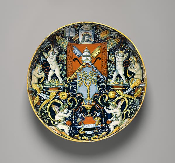 Bowl with the Arms of Pope Julius II and the Manzoli of Bologna surrounded by putti, cornucopiae, satyrs, dolphins, birds, etc., by workshop of Giovanni Maria Vasaro