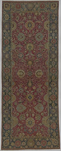 Indo-Persian carpet with vine scroll and palmette pattern