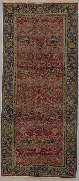 Indo-Persian carpet with vine scroll and palmette pattern