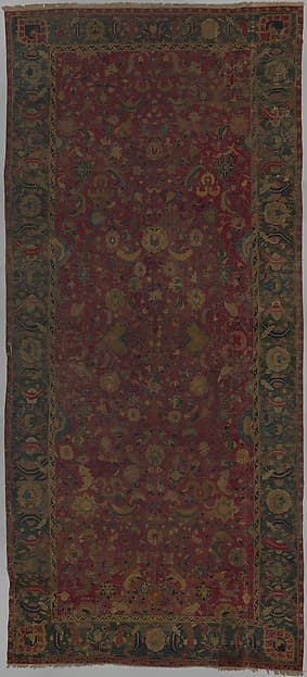 Indo-Persian carpet with vine scroll and palmette pattern